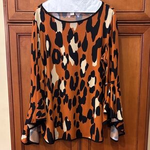 Chic Animal Print Blouse in Black and Tan